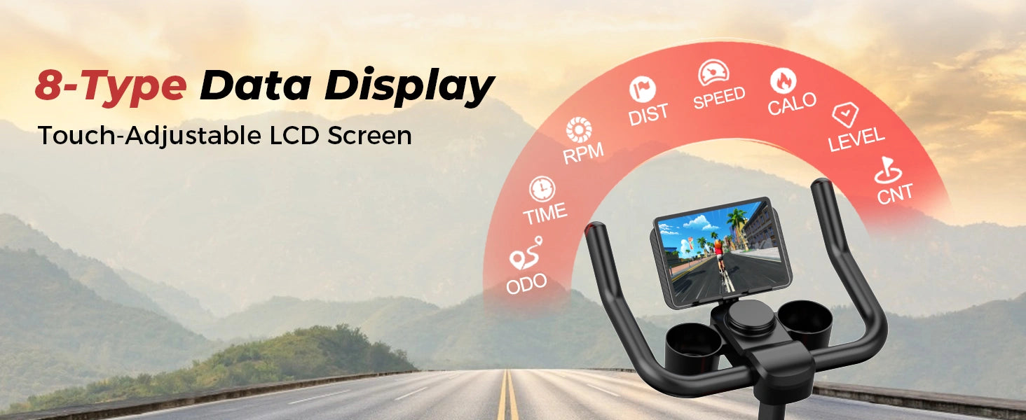 Kuntopyörä digitaalisella näytöllä ja vuoristotien taustalla