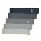 5 mustaa, harmaata ja valkoista vastuskuminauhaa valkoisella taustalla